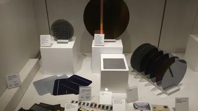 A row of silicon wafers on display, the raw material from which memory and processor chips are made for smartphones, laptops and AI datacentres.