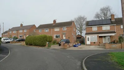 A detached house with garden in the United Kingdom, representing residential property ownership.