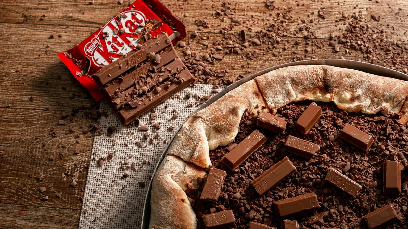 Indulge in a unique fusion of pizza and KitKat chocolate bars, perfect for dessert lovers.