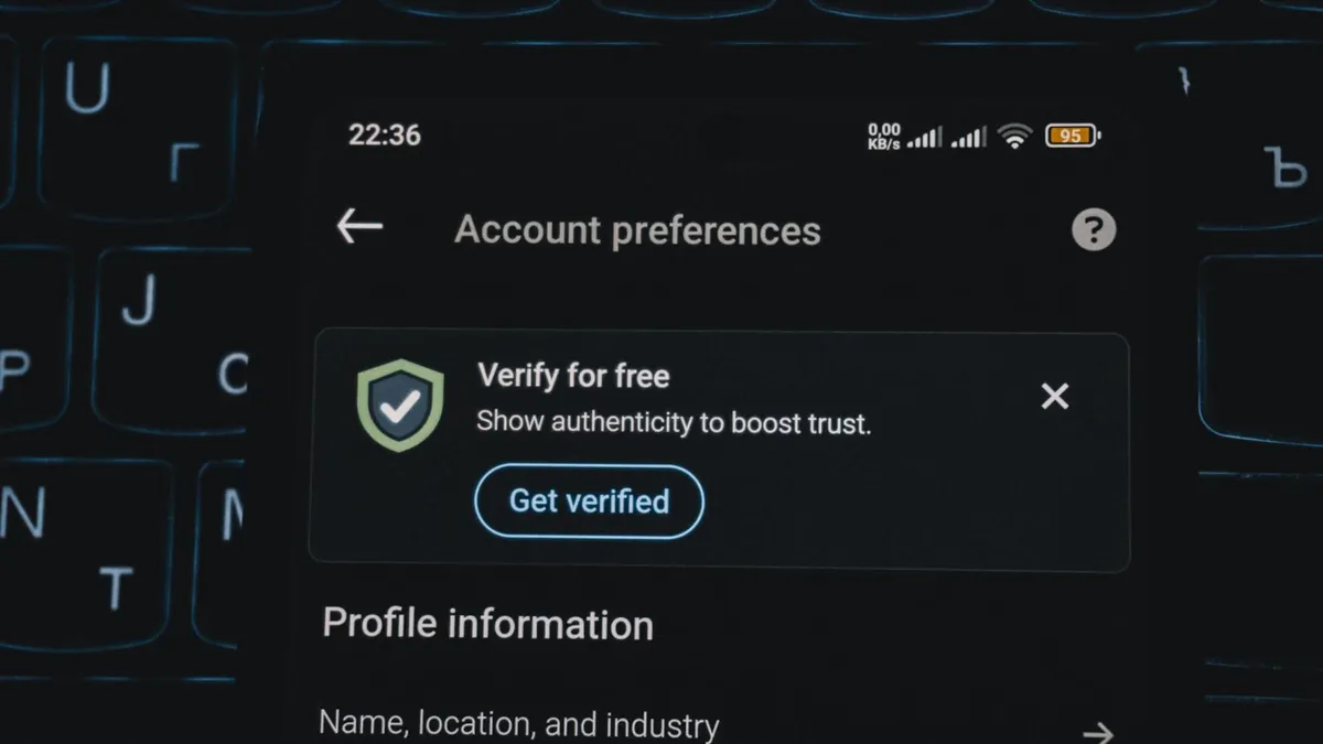 Close-up of a smartphone screen displaying account verification alert. Ideal for security and authenticity themes.