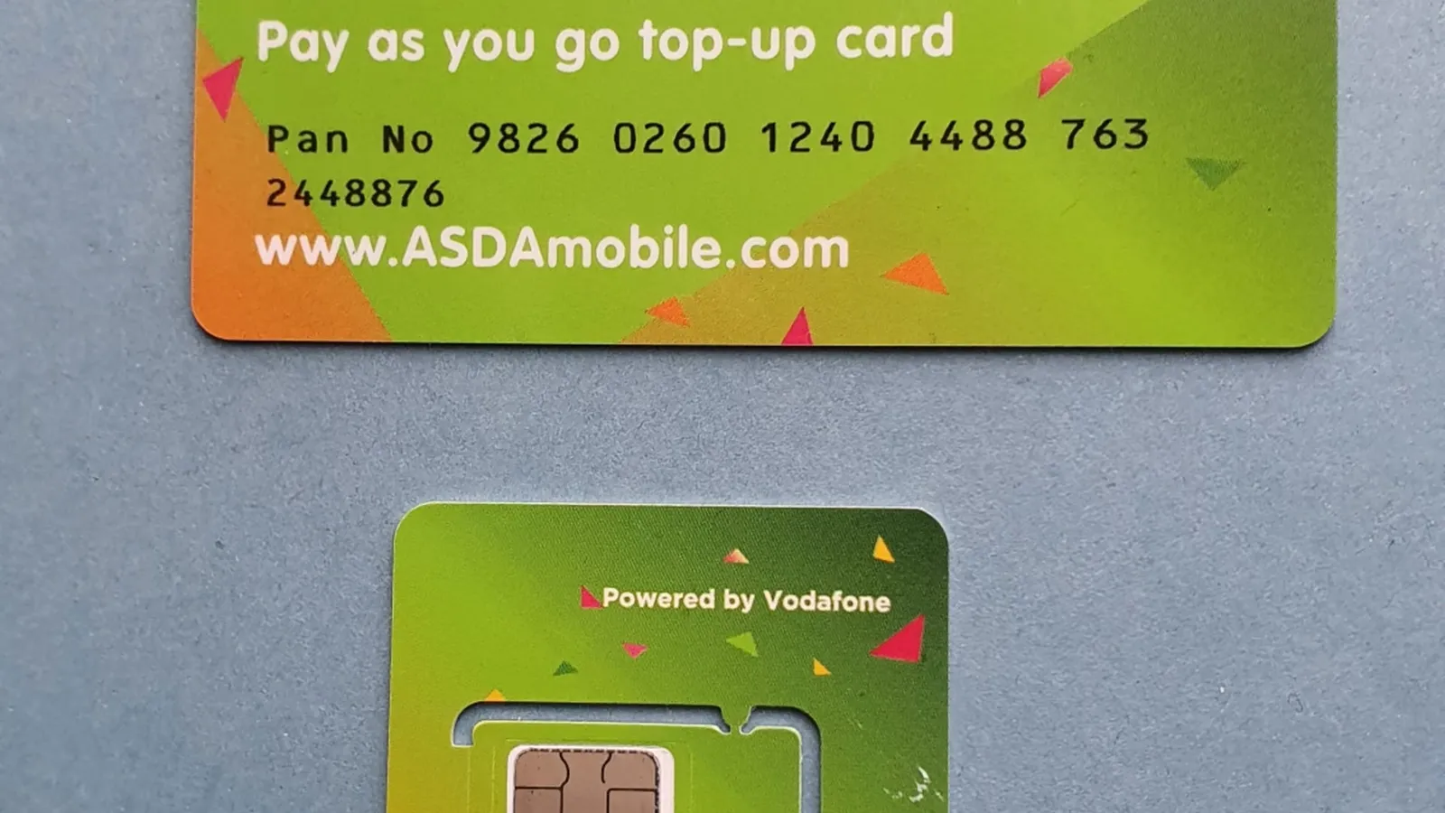 Close-up of a mobile phone with SIM card slot, representing mobile number portability and network switching.