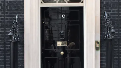 The black front door of 10 Downing Street, official residence of the UK Prime Minister, symbolising the open letter addressed to Keir Starmer.