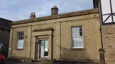 Exterior of a traditional UK savings bank building representing National Savings and Investments.