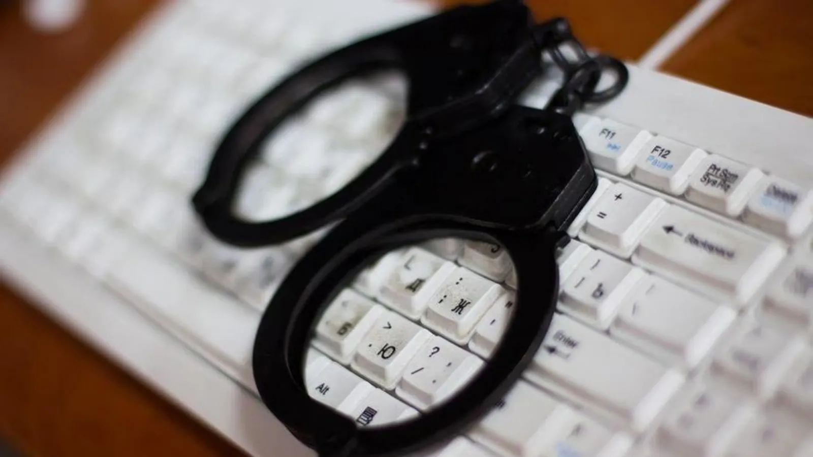 Digital security warning symbol representing online fraud and financial crime threats.