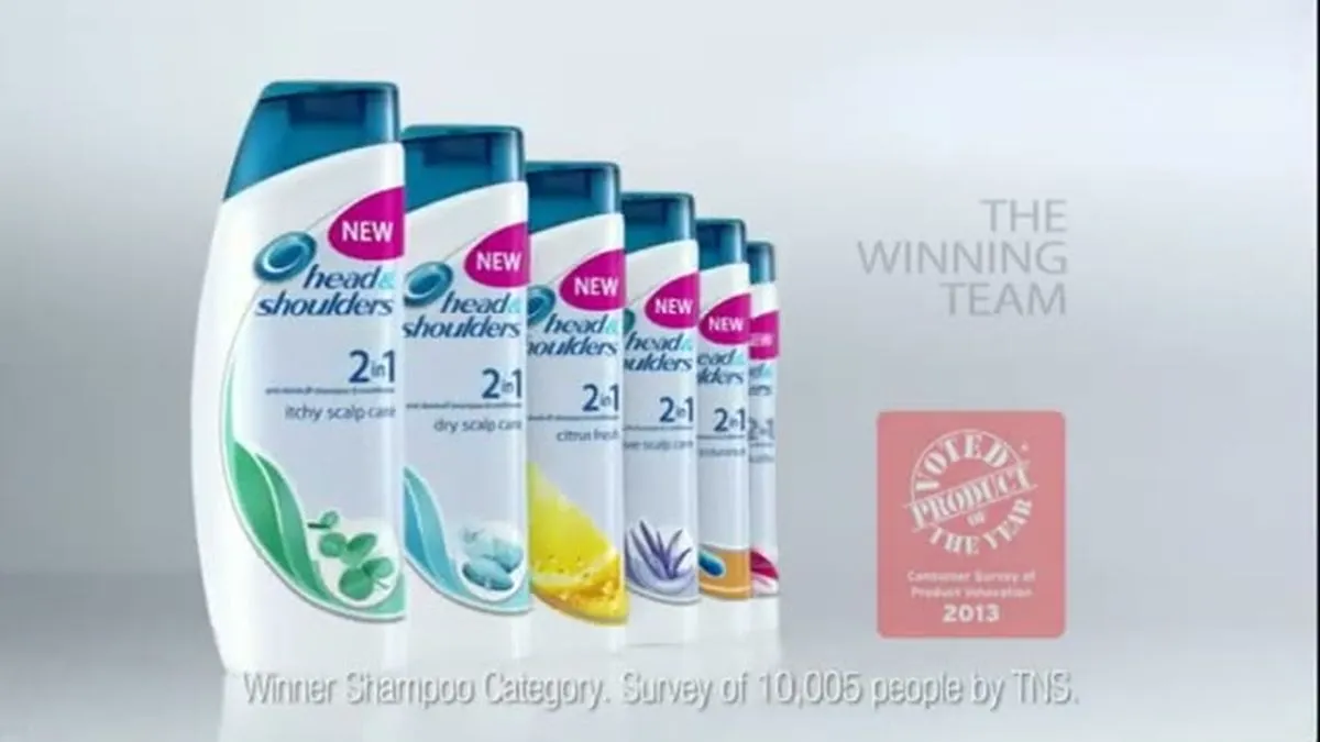 A line of Head & Shoulders shampoo bottles in various colors, with text 'THE WINNING TEAM' and a 'Product of the Year' award.