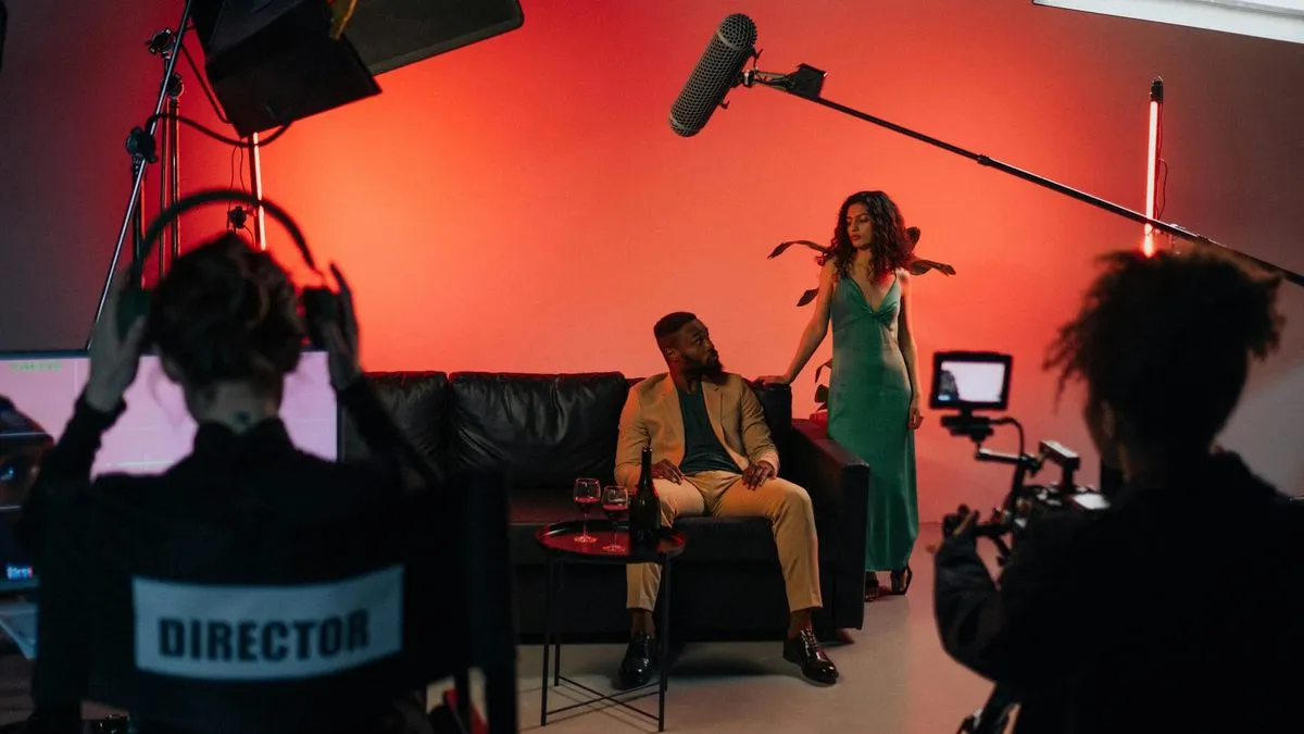A director in a chair with 'DIRECTOR' on the back, overseeing a film set with actors.